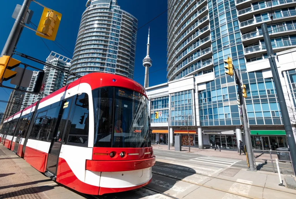 Toronto Transit red electric bus running through Toronto City