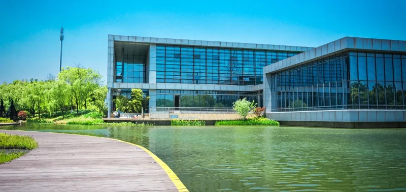 Pool of water beside a modern building